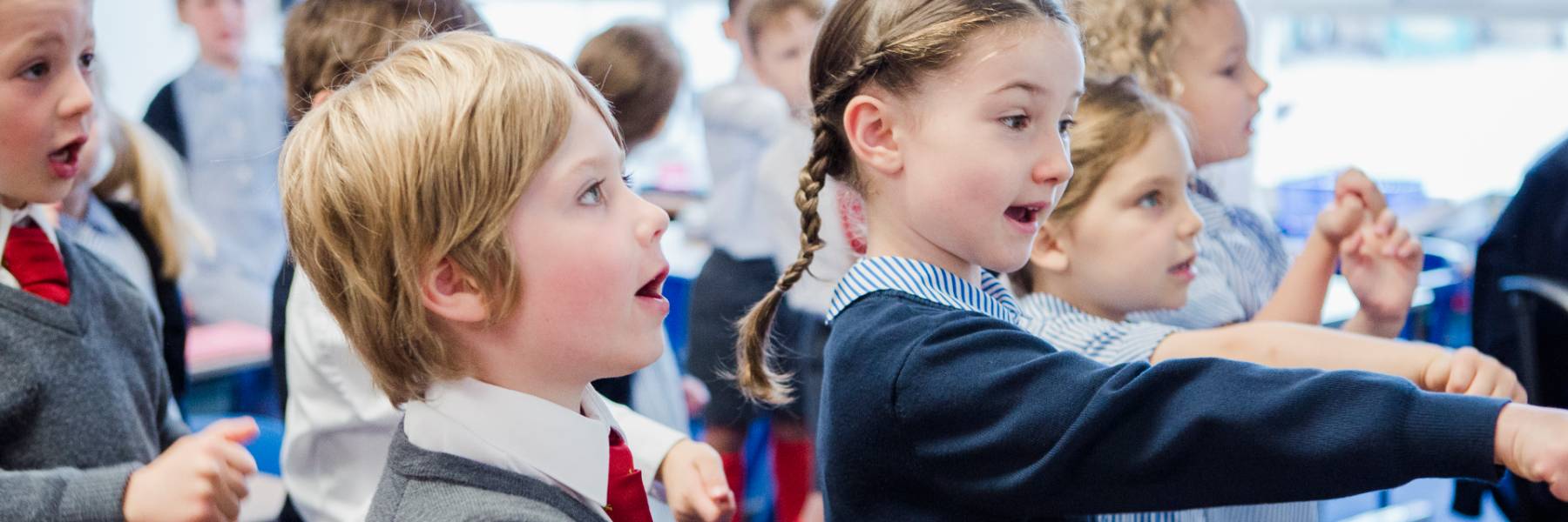 Junior school children use smart screens